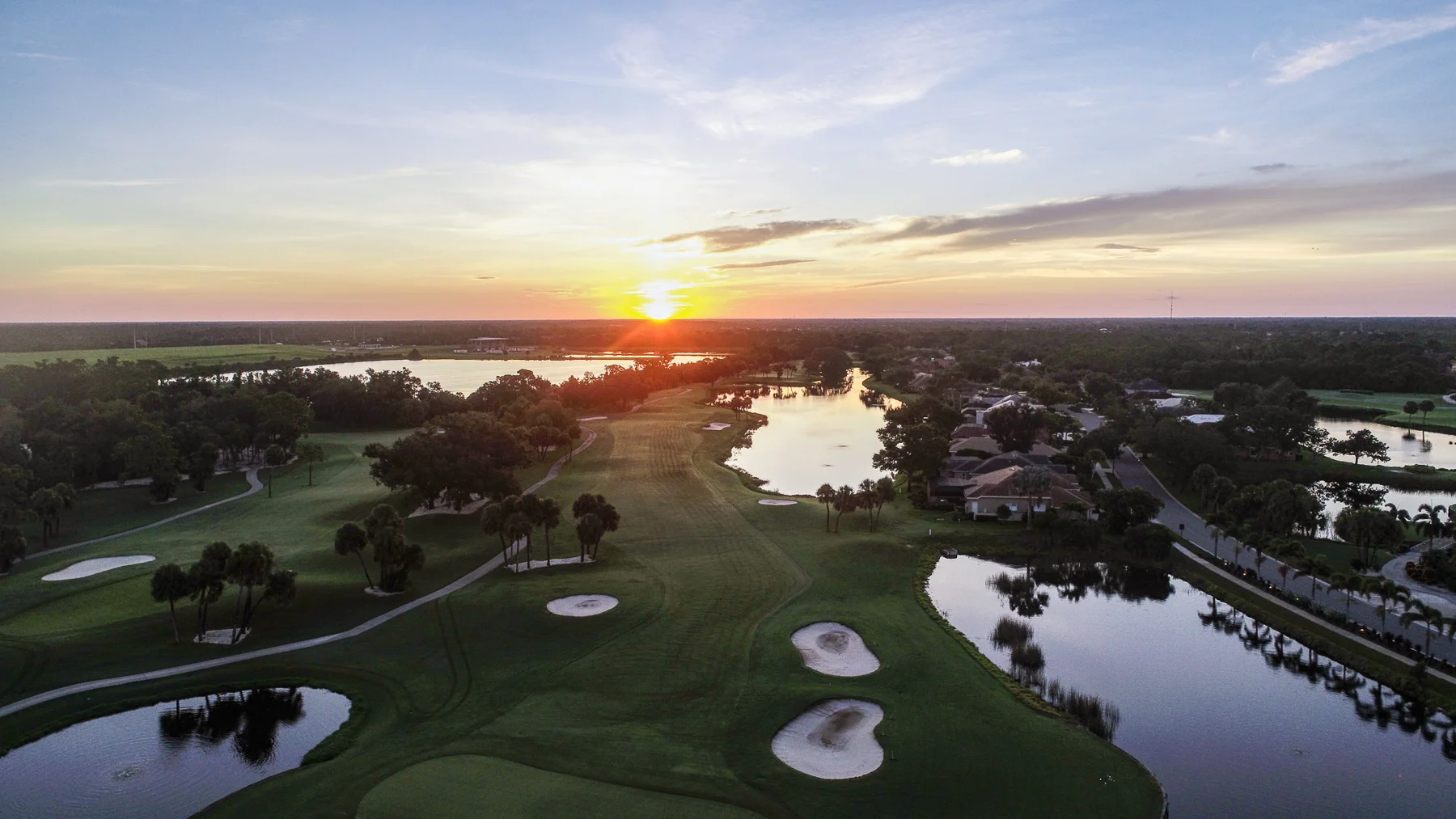 Sunset over the golf course and lakes at Venice Golf and Country Club, Florida
